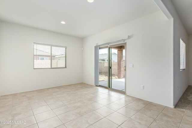 unfurnished room with light tile patterned floors