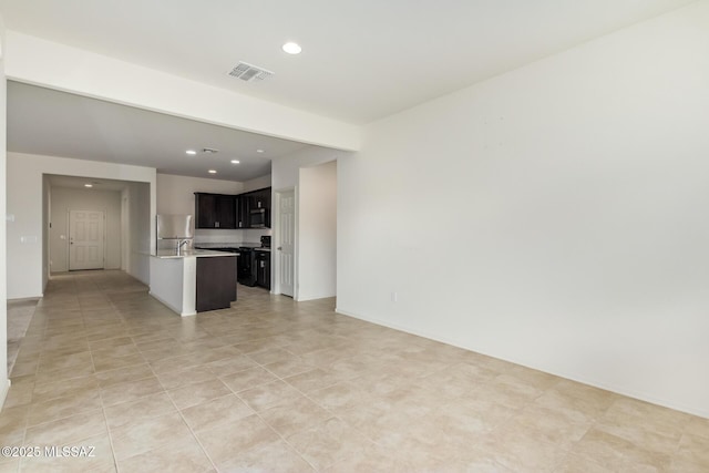 unfurnished living room featuring light tile patterned flooring