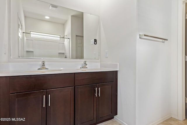 bathroom with a shower and vanity