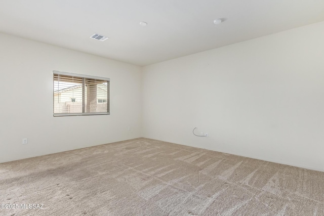 spare room featuring carpet flooring