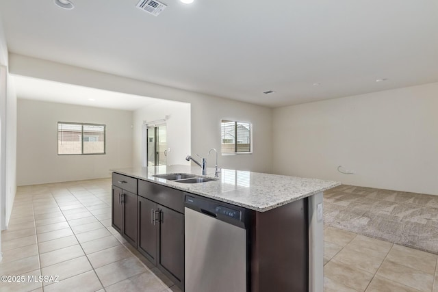 kitchen with an island with sink, sink, stainless steel dishwasher, and a healthy amount of sunlight