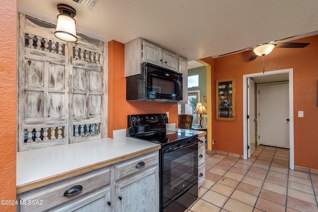 kitchen featuring ceiling fan, light tile patterned floors, a textured ceiling, and black appliances