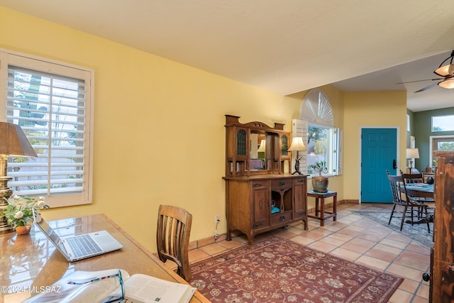 tiled home office with ceiling fan