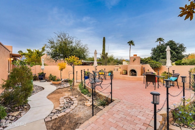 view of patio / terrace featuring an outdoor fireplace