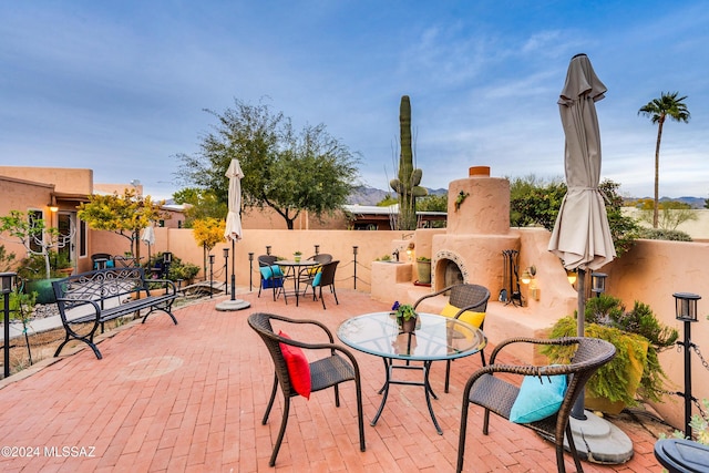 view of patio featuring exterior fireplace