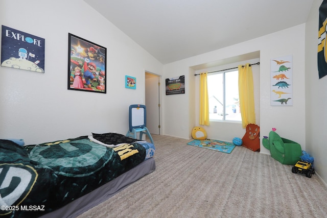 carpeted bedroom with vaulted ceiling