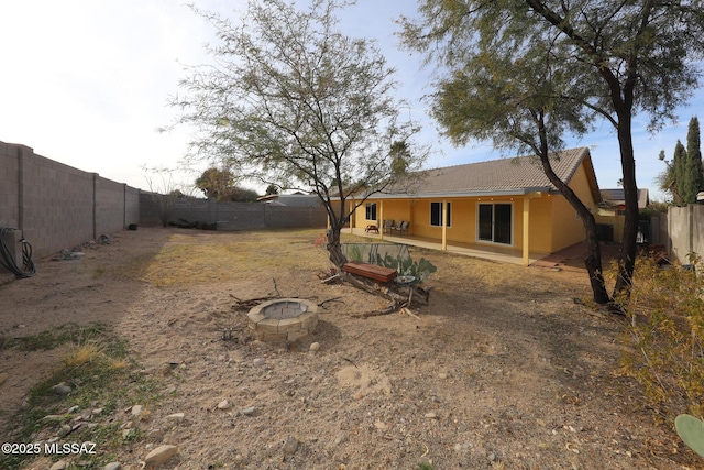 view of yard featuring a patio area and a fire pit