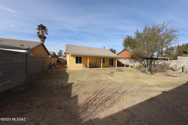 back of property featuring a patio area