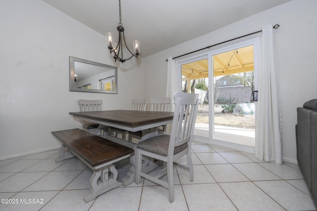 tiled dining area with a wealth of natural light, a notable chandelier, and vaulted ceiling