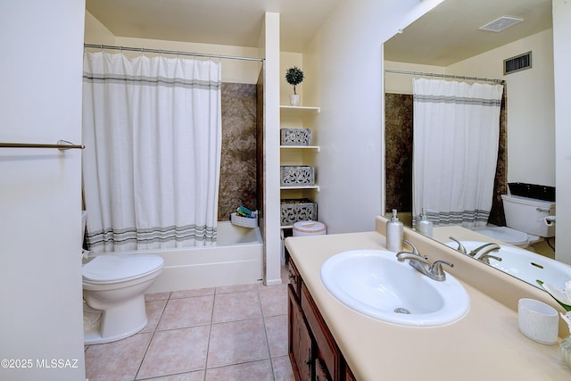 full bathroom with shower / bath combo, vanity, tile patterned floors, and toilet