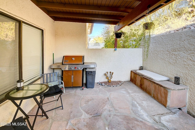 view of patio featuring a grill