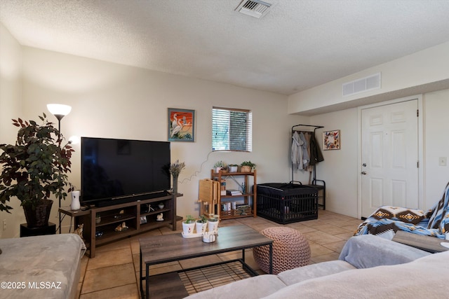 tiled living room with a textured ceiling