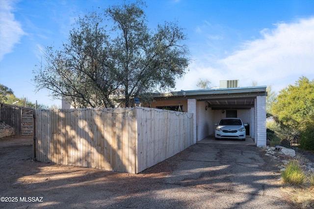 exterior space featuring a carport