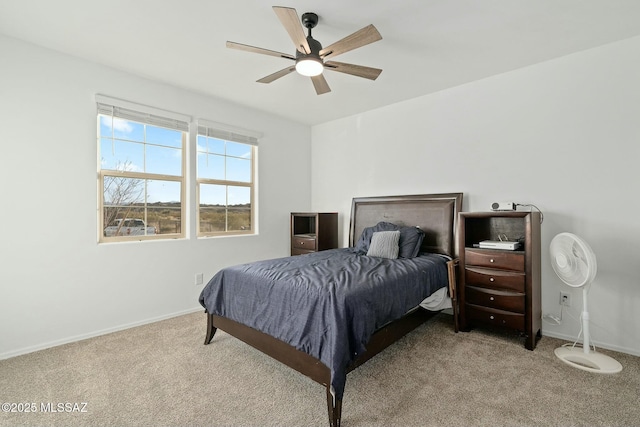 bedroom with light carpet and ceiling fan