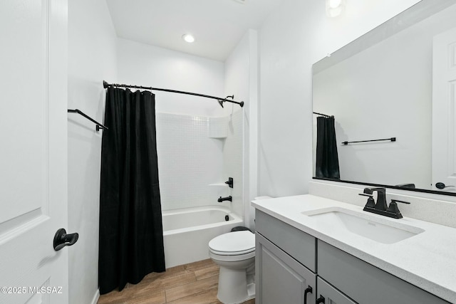 full bathroom with vanity, toilet, and shower / tub combo with curtain