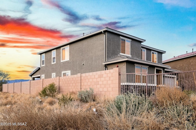 view of property exterior at dusk