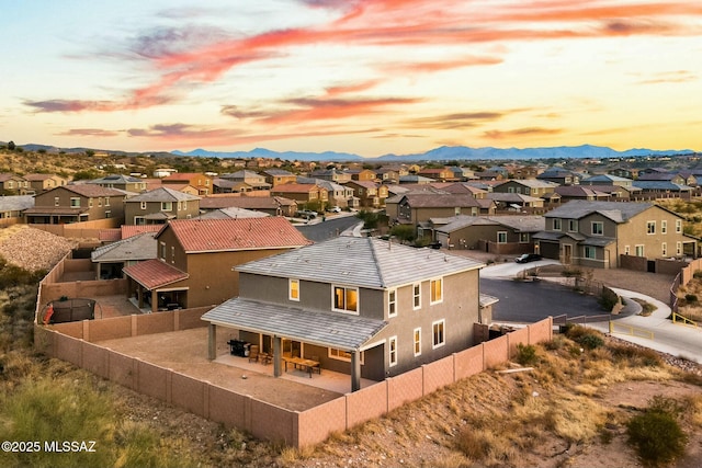 aerial view at dusk with a mountain view