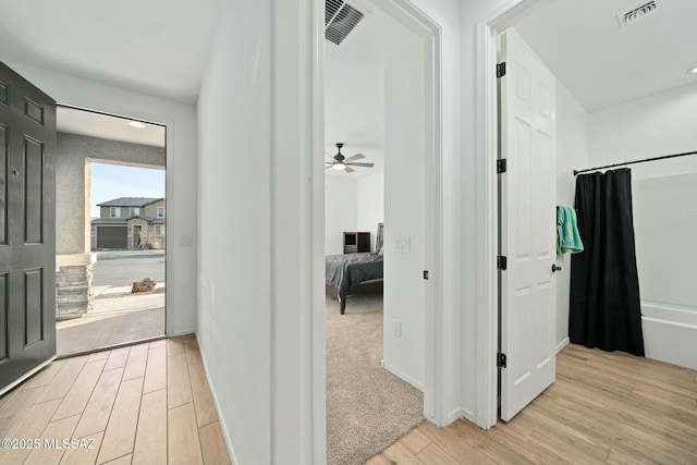 corridor featuring light wood-type flooring