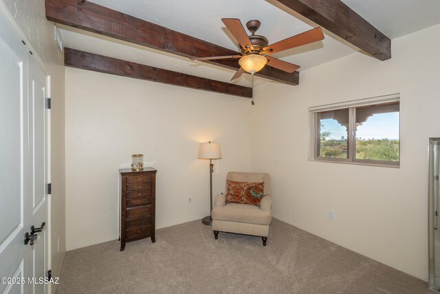 living room featuring ceiling fan and beamed ceiling