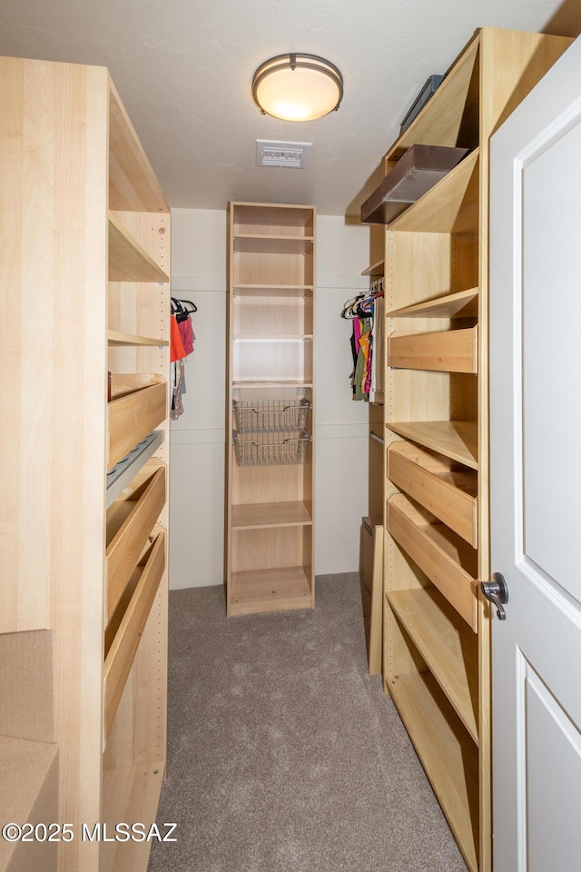 walk in closet with carpet flooring and visible vents