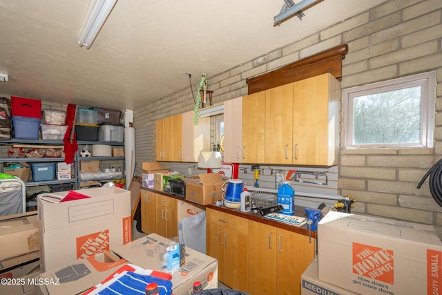 kitchen with brick wall