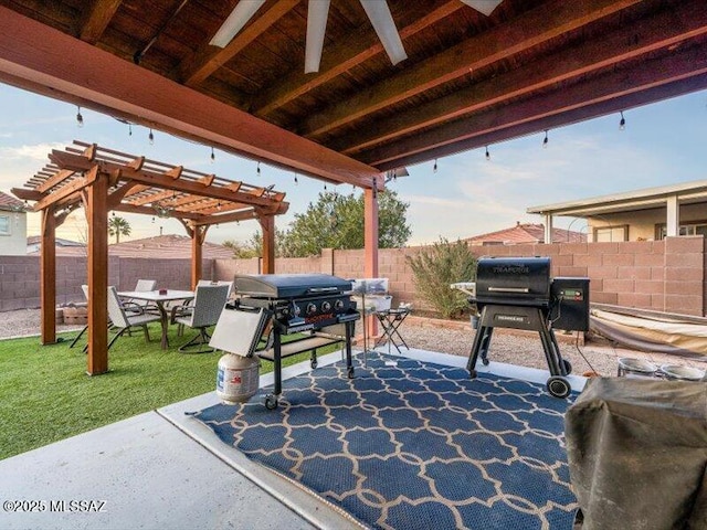 view of patio with a grill and a pergola