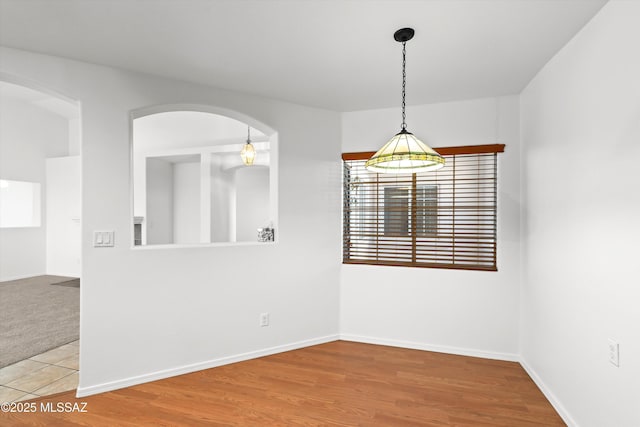 unfurnished dining area with hardwood / wood-style flooring