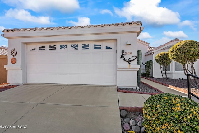 mediterranean / spanish-style house featuring a garage