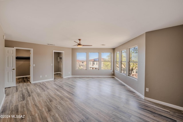 unfurnished room featuring ceiling fan and wood-type flooring