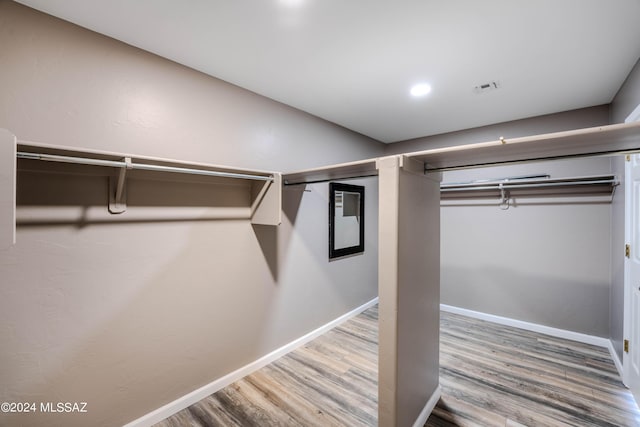 walk in closet featuring wood-type flooring