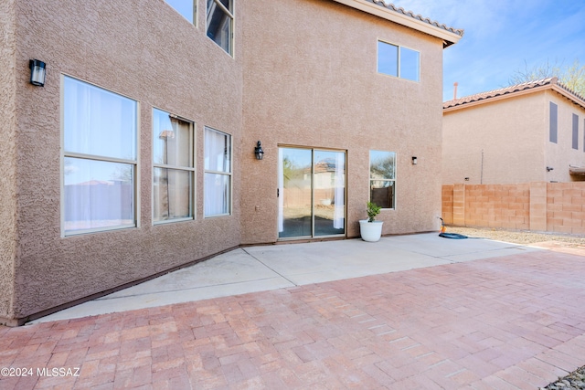 rear view of house with a patio