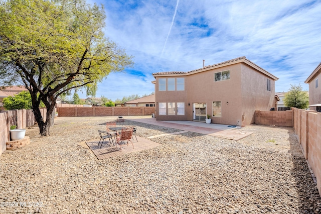 rear view of house with a patio