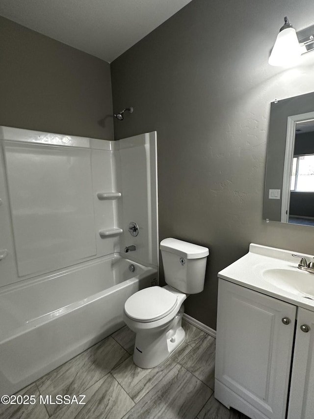 full bathroom featuring toilet, vanity, and bathtub / shower combination