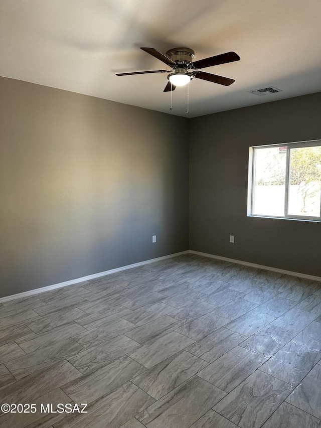 unfurnished room with ceiling fan