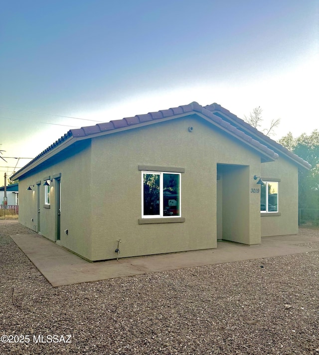 rear view of house with a patio