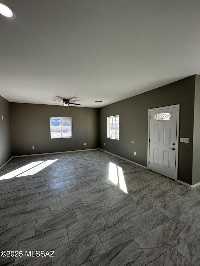 spare room with ceiling fan