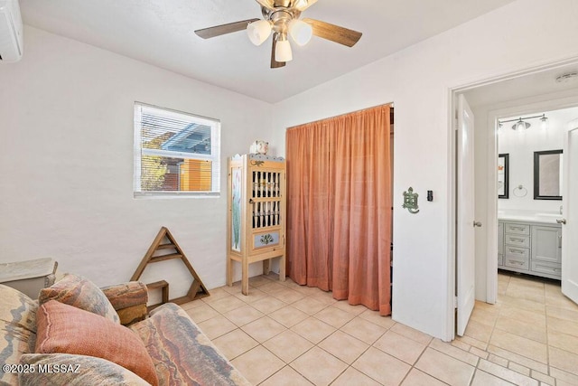 tiled living room featuring ceiling fan and a wall mounted air conditioner