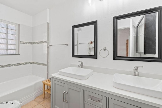 bathroom featuring tile patterned flooring and vanity