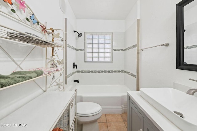 full bathroom with tile patterned floors, vanity, toilet, and tiled shower / bath