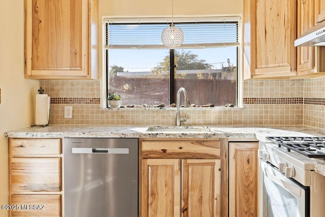 kitchen with pendant lighting, dishwasher, sink, backsplash, and light stone counters