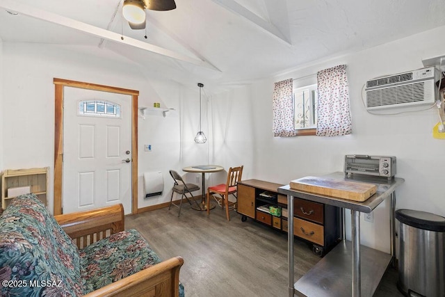 entryway featuring lofted ceiling, hardwood / wood-style floors, plenty of natural light, and a wall unit AC