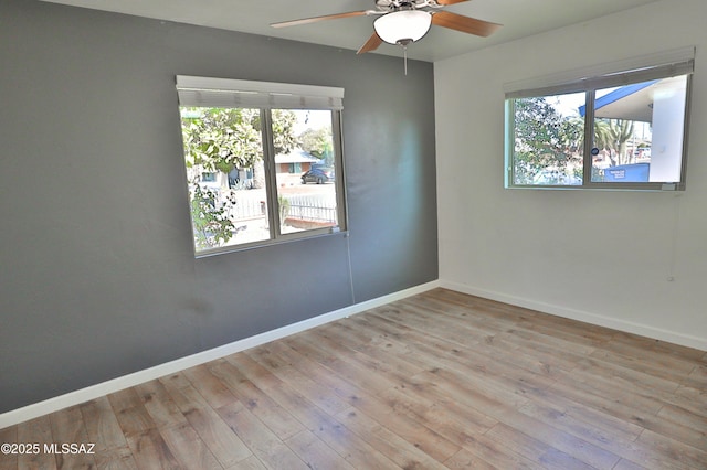 unfurnished room featuring light hardwood / wood-style floors and ceiling fan