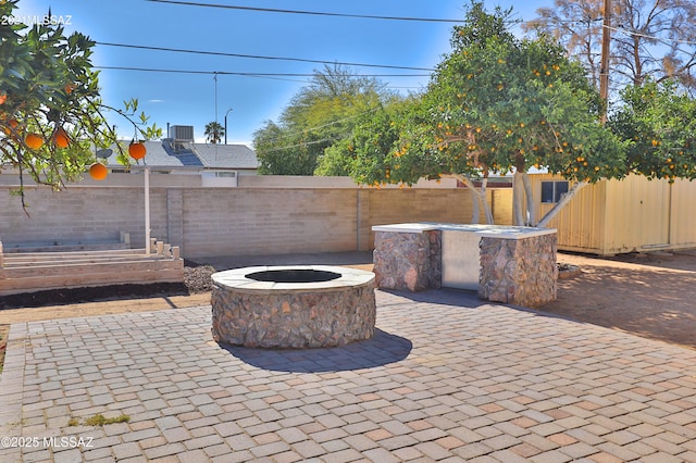 view of patio / terrace with a fire pit