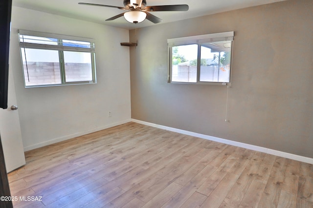 unfurnished room featuring ceiling fan and light wood-type flooring