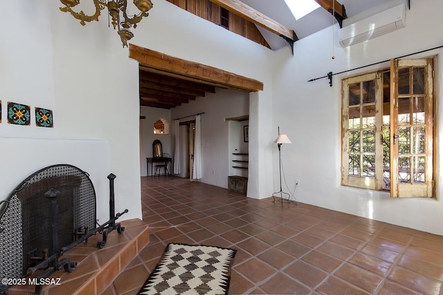 living room with a skylight and beamed ceiling