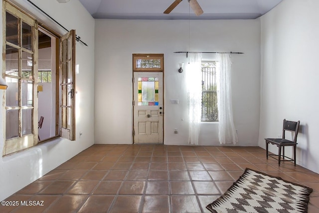 foyer with tile patterned flooring and ceiling fan