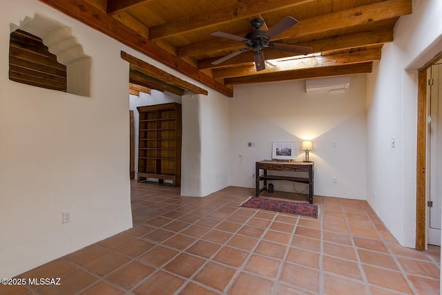 tiled spare room with ceiling fan, wooden ceiling, a wall mounted AC, and beamed ceiling