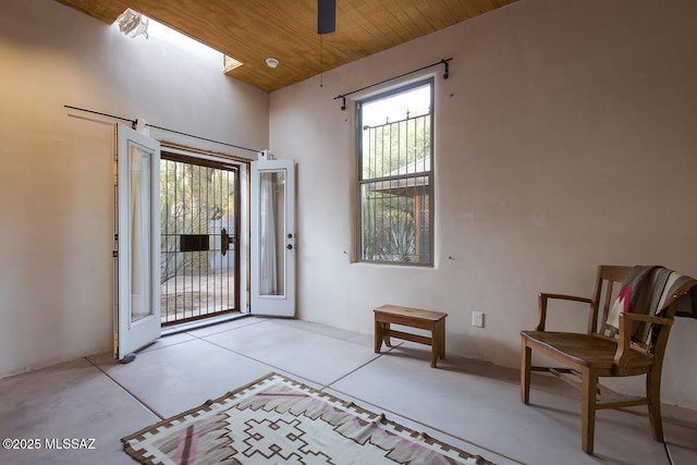 doorway to outside with wooden ceiling