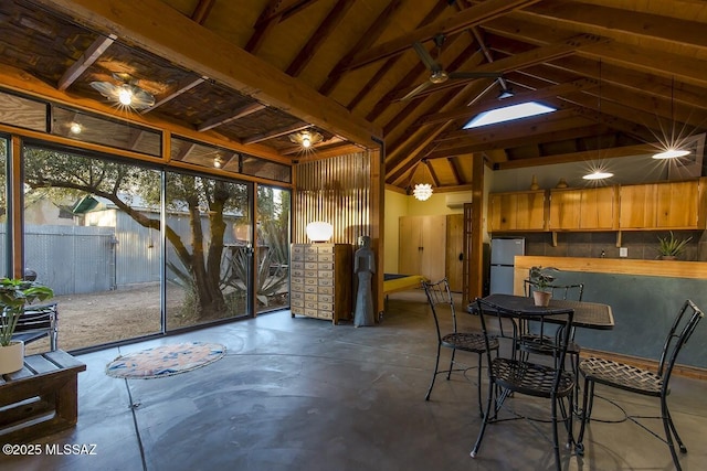 interior space featuring lofted ceiling with beams