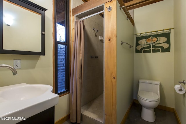 bathroom with sink, toilet, and a shower with curtain